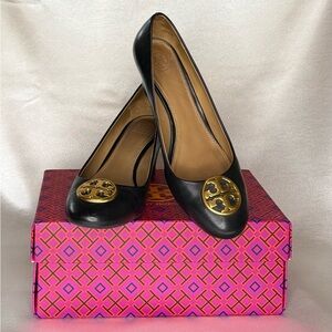Tory Burch Black Flats with Gold Emblem.